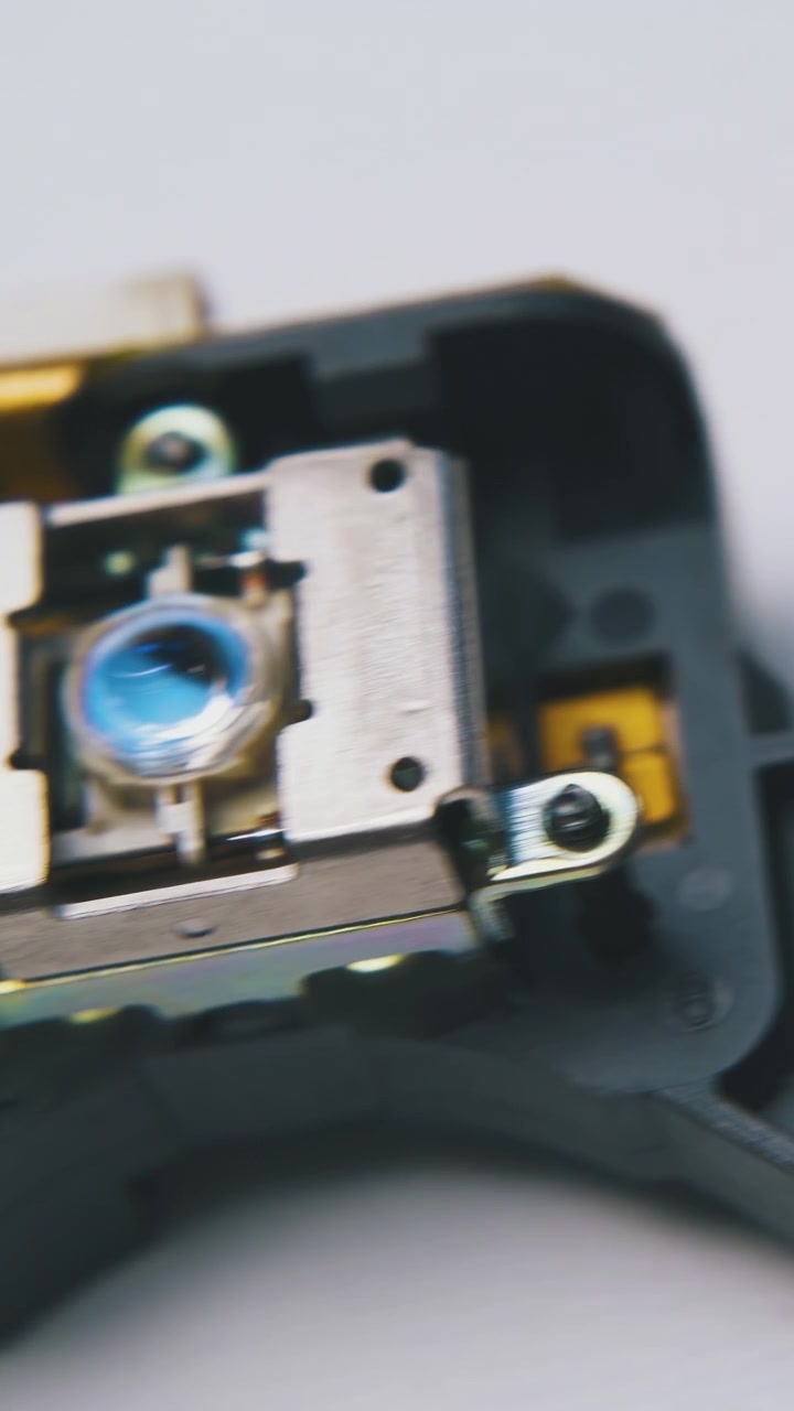 motion along set of different small electronic parts lying on clean white background extreme close view