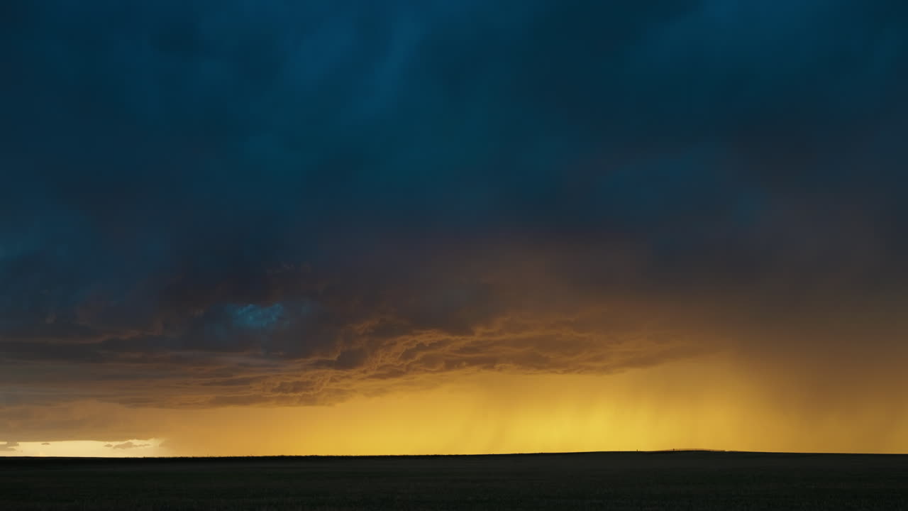 Beautiful Sunset Colors Shine Through Storm Clouds and Lightning