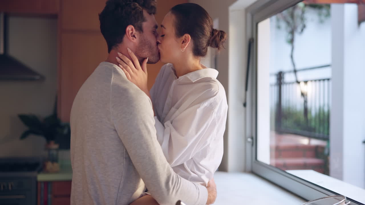 Relax, morning or couple kiss in kitchen