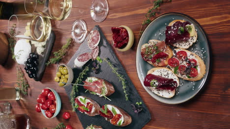 appetizing charcuterie board with wine and bruschetta