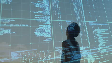 Standing against digital code, silhouette person with animation projection in school