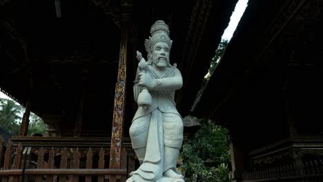 Slow-motion-dolly-shot-of-a-sacred-statue-at-pura-tirta-empul-temple-on-bali-in-ubud-indonesia