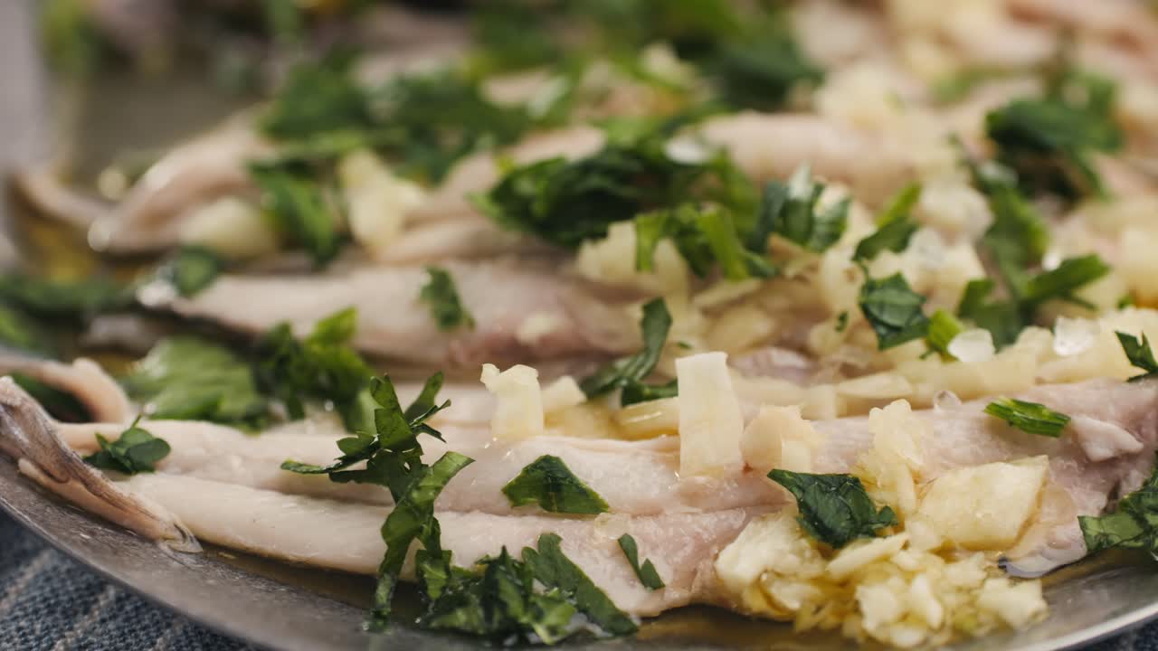 Fresh Sea sardines and Anchovy Fish and Mullus On Display On Ice On Market Store Shop. Seafood Fish Background, close up stand of small salty white fish.