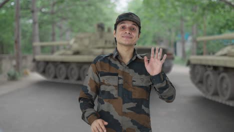 happy indian army man waving hello