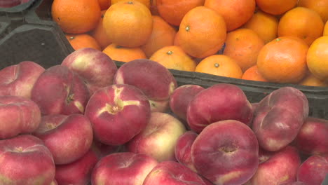 peaches and oranges at a farmers market