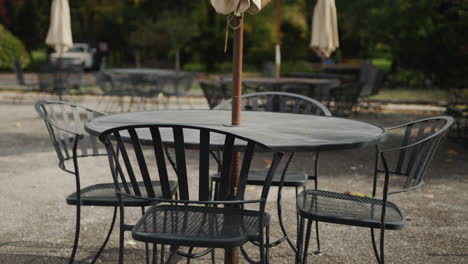 Tables-and-chairs-on-the-summer-area-of-the-restaurant.-No-visitors-at-the-end-of-the-season