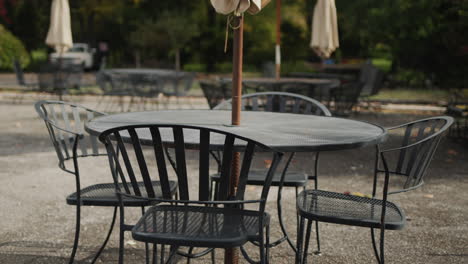 tables and chairs on the summer area of the restaurant. no visitors at the end of the season