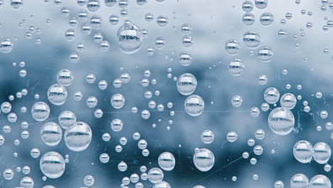 water bubbles with a gradient light and dark background, slowly growing and then releasing to move up towards the surface