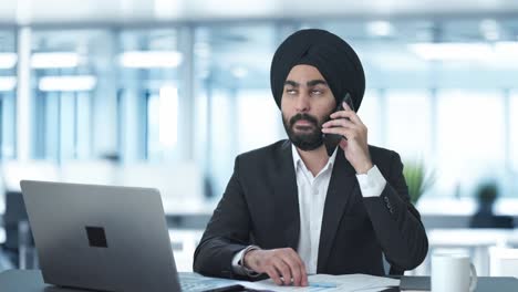 sikh indian businessman talking on call