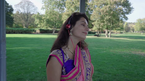 girl in saree with headphone