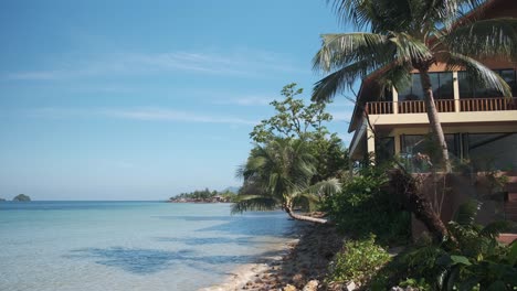 4k-static-shot-of-resort-with-palm-trees-with-tropical-blue-ocean-on-Koh-Chang-island