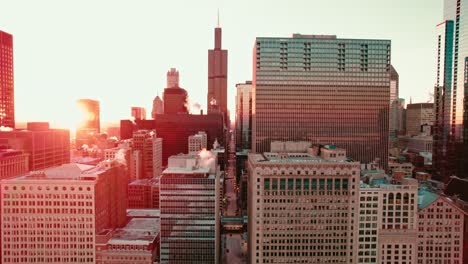 the chicago skyline is revealed on a cold winter day, featuring the city's iconic architecture amidst the frosty atmosphere