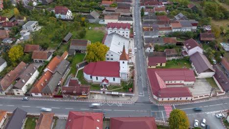 Aerial-View-of-Cars-Driving-Through-The-Town-In-Brasov,-Romania
