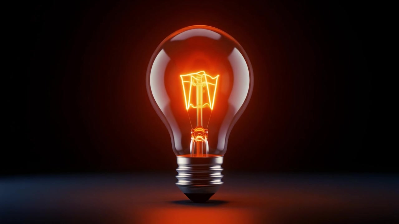 Lampadina a Incandescenza che si Accende Gradualmente in una Stanza Buia