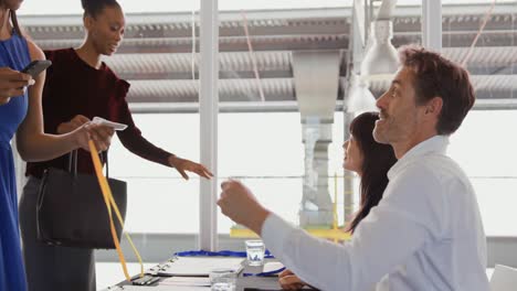 Attendees-at-a-business-conference-collect-their-name-badges-as-they-arrive