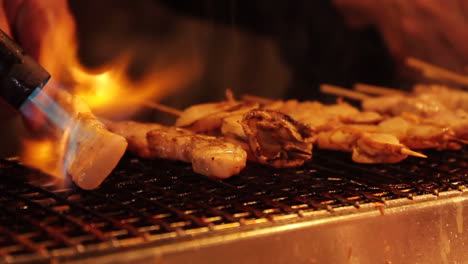 seafood being grilled in street market kyoto japan