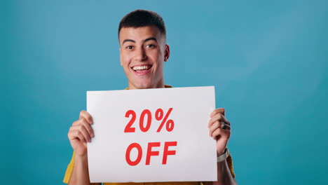man holding a 20% off sign