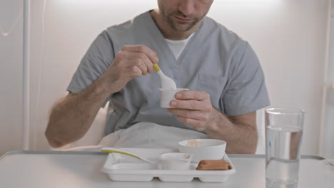 person eating hospital food