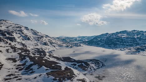 flight over the frozen lakes in norwegian tundra