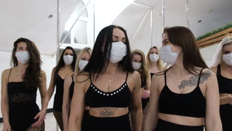 group of beautiful girls at a fashion show they are in a protective mask against the coronavirus group of beautiful girls at a fashion show they are in a protective mask against the coronavirus life during a pandemic covid19