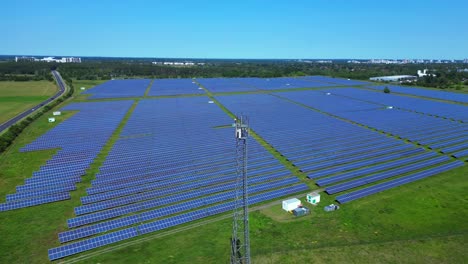 5g telecommunication tower in a huge solar panel plant in germany, capturing the convergence of technology and sustainability. very close flight majestic aerial view flight drone