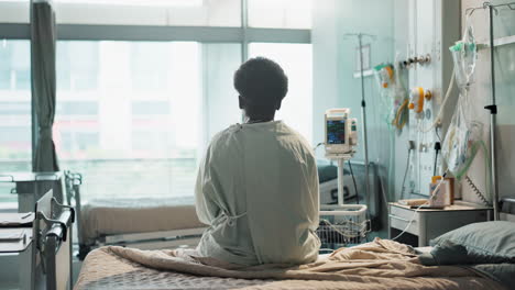 patient, hospital and sitting on bed with sad