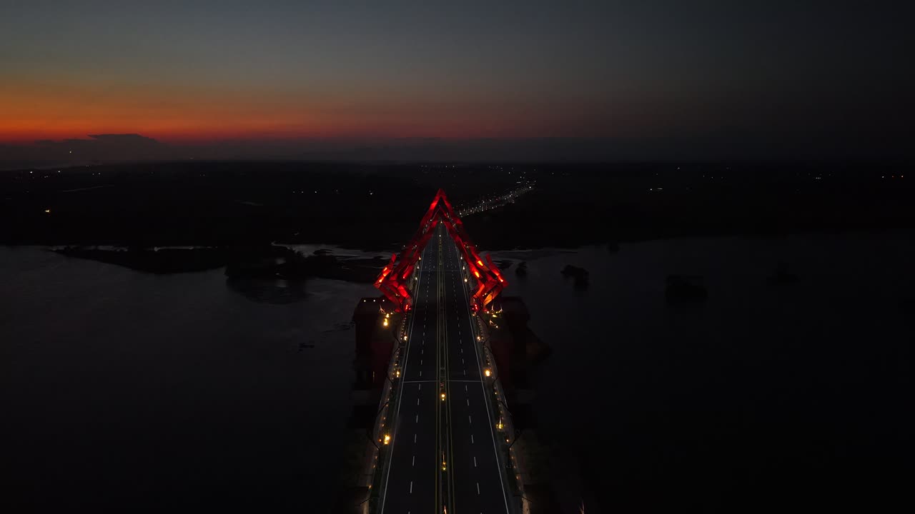 Aerial view, night view of the architecture of the Pandansimo Bridge, which is a bridge connecting the southern ring road in the Bantul area of Yogyakarta