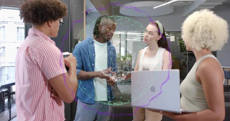 Male lead raising hands in tech office, summoning holographic data while team collaborating