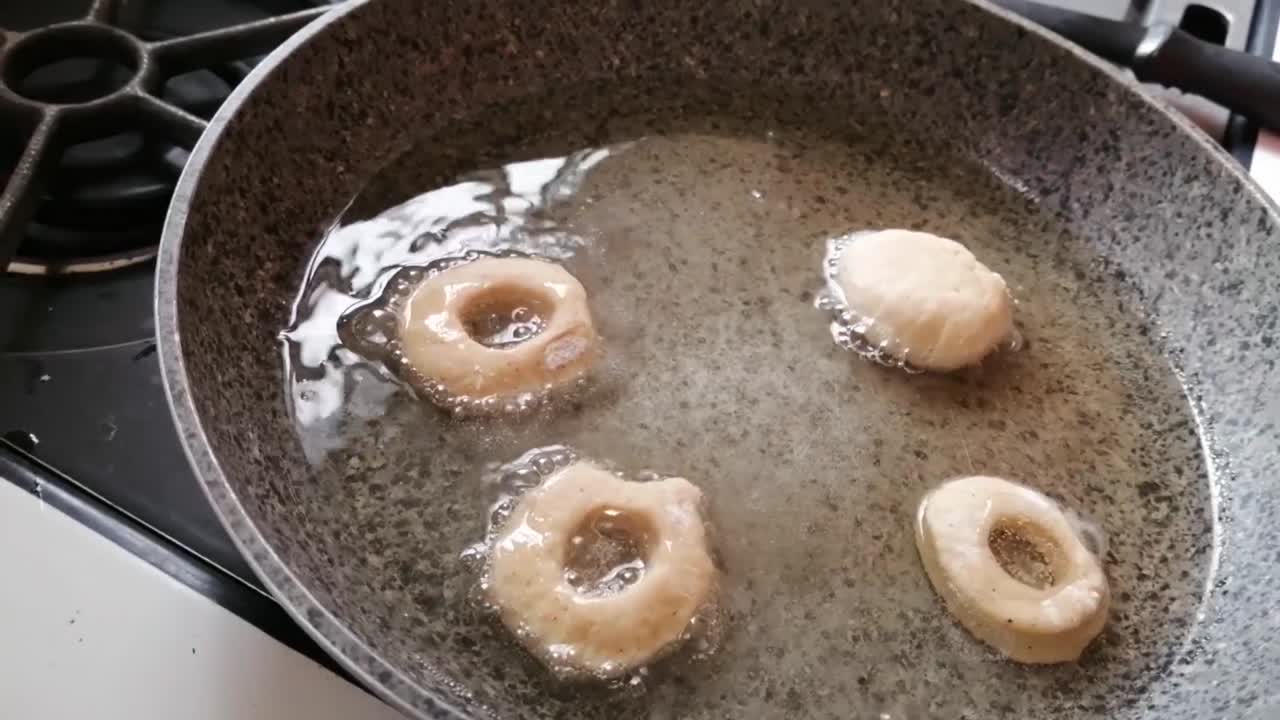 cooking homemade donuts as a family on a Sunday
