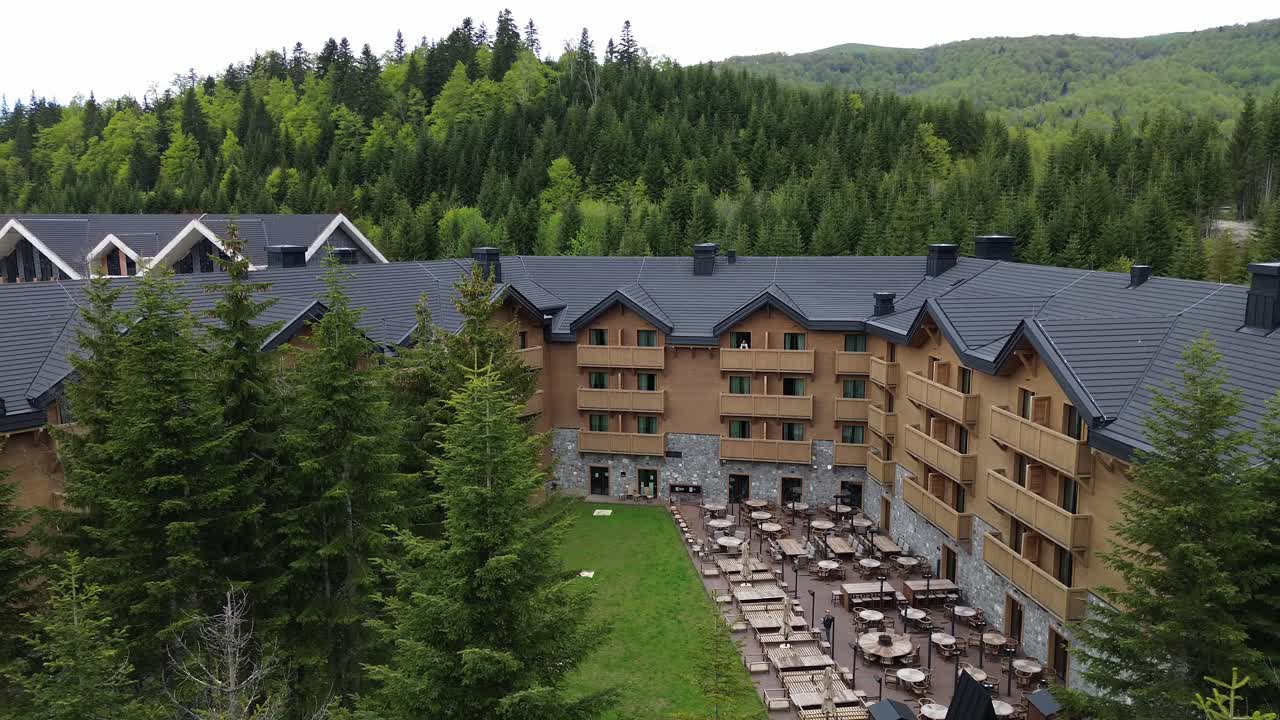 Luxury ski resort surrounded by lush pine forest in summer near Biogradska Gora National Park, Swissotel resort, Drone