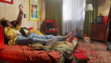 couple relaxing in a retro bedroom