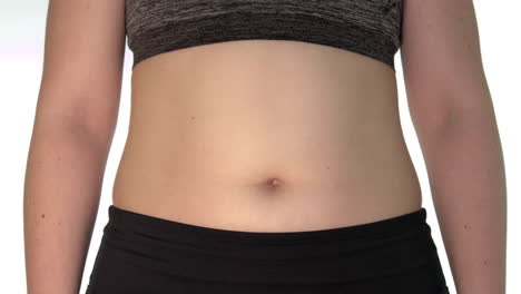 A-close-up-of-a-woman's-belly-with-a-visible-navel