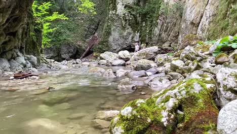child hiking in a mountain river canyon