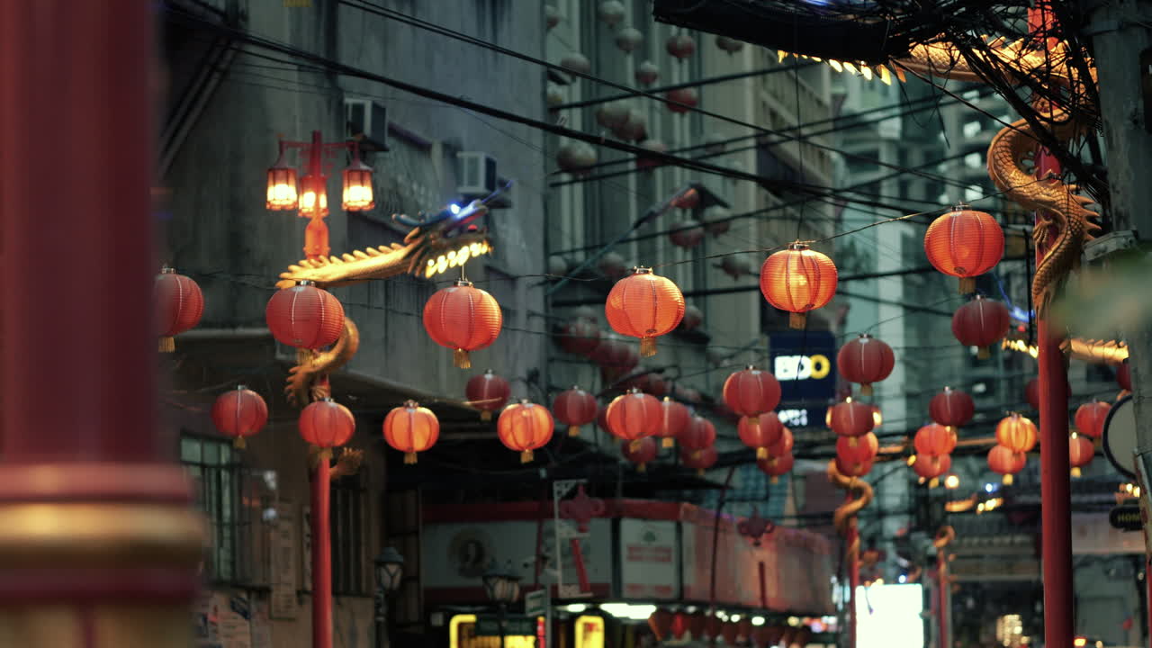 Vibrant Night Street with Chinese Lanterns and Dragon Decorations