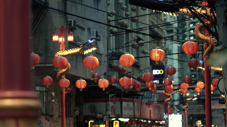 Vibrant Night Street with Chinese Lanterns and Dragon Decorations
