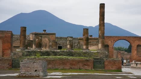 Ruins of famous Pompeii city, Italy.Temple of Aesculapius or Jupiter Meilichios and Mount Vesuvius