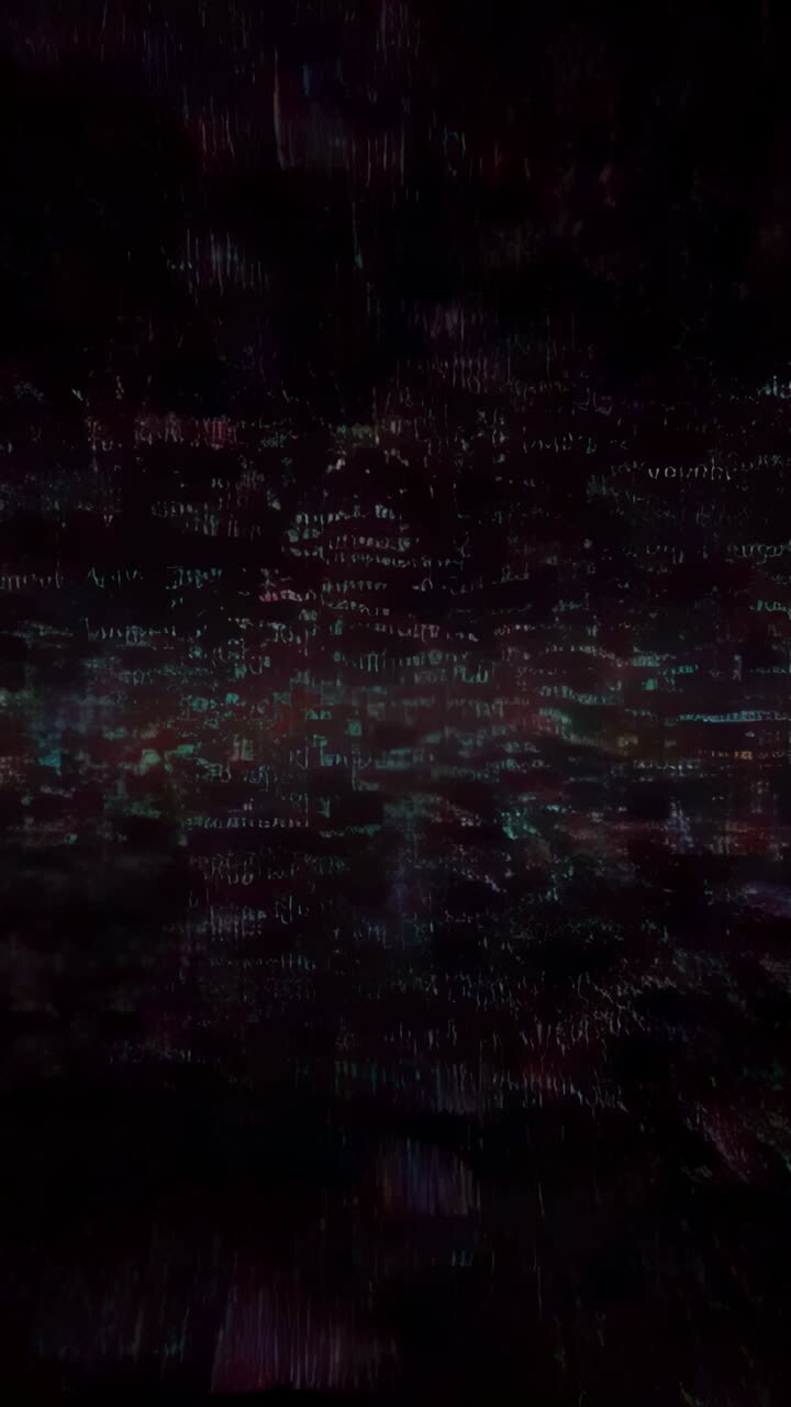 Vertical video: Opening red cyan pixels shifting downward in digital void, with falling data rain