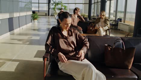 woman waiting at airport lounge