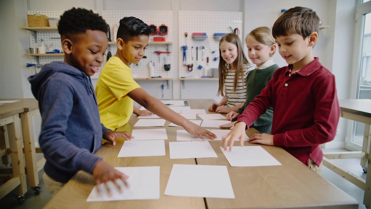 Placing blank sheets, five kids spreading, smoothing and aligning on bench, forming grid, pegboard