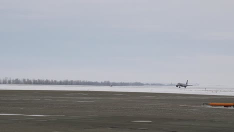 airplane landing at a snowy airport