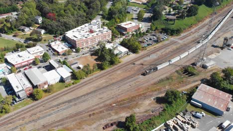 4K-Aerial-Drone-Video-of-French-Broad-River,-Norfolk-Southern-Train-Yard-and-River-Arts-District-in-Asheville,-NC