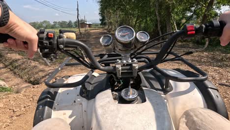 first-person view of riding an atv outdoors