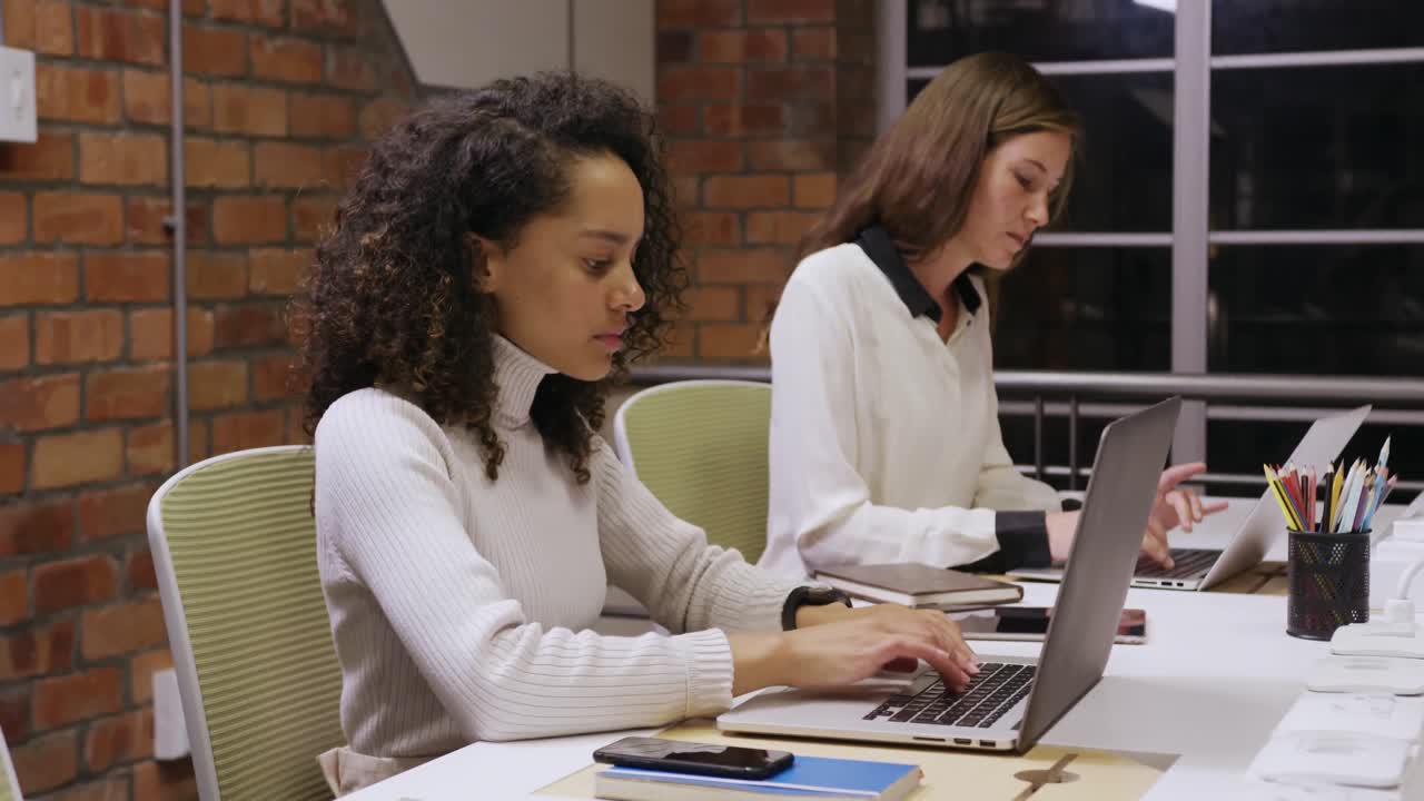 Two creative bussinesswoman working in modern office