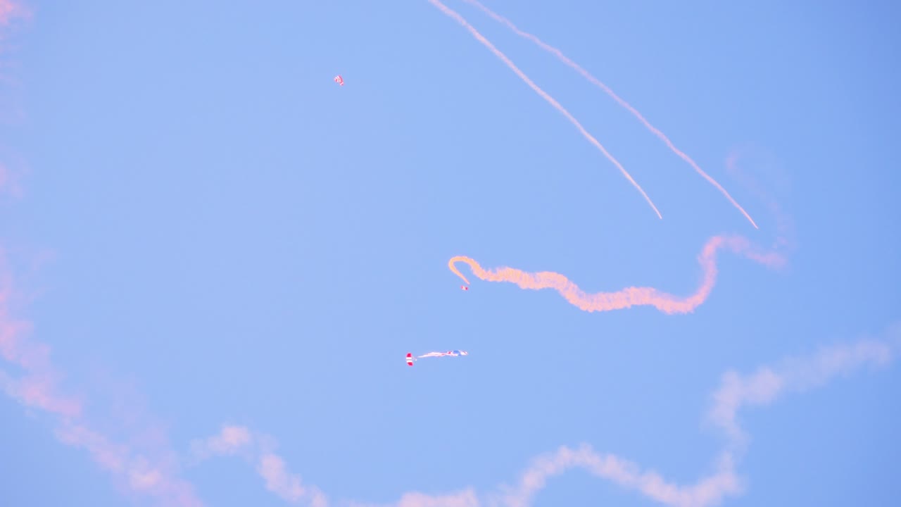 Skydiving and Air Show with Colorful Smoke Trails