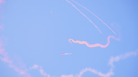 skydiving and air show with colorful smoke trails