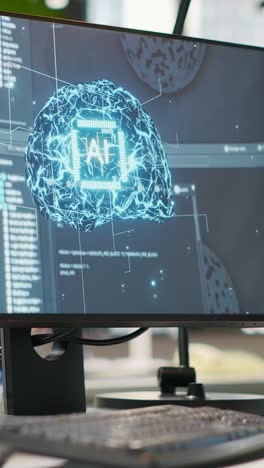 vertical video pc display on startup office desk showing artificial intelligence code