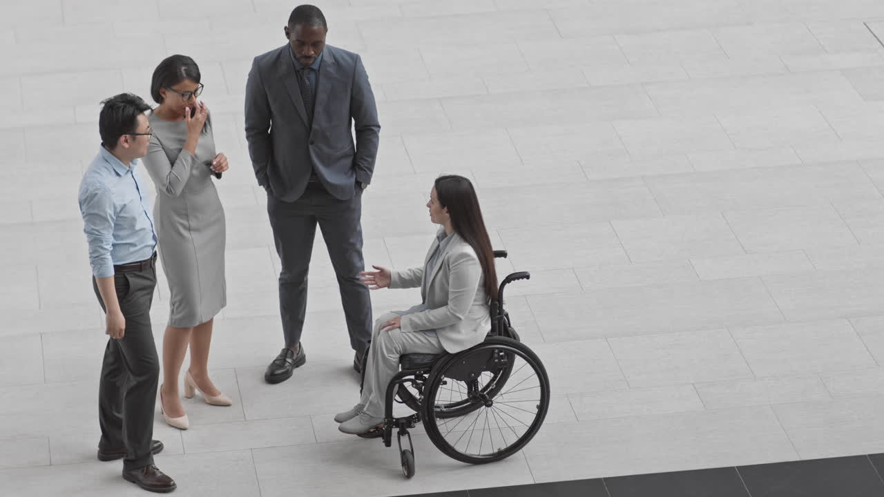 Four Multiethnic Businessmen and Businesswomen Communicating