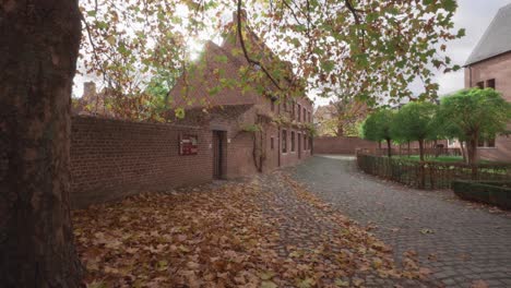 great beguinage in autumn fall, leuven, belgium