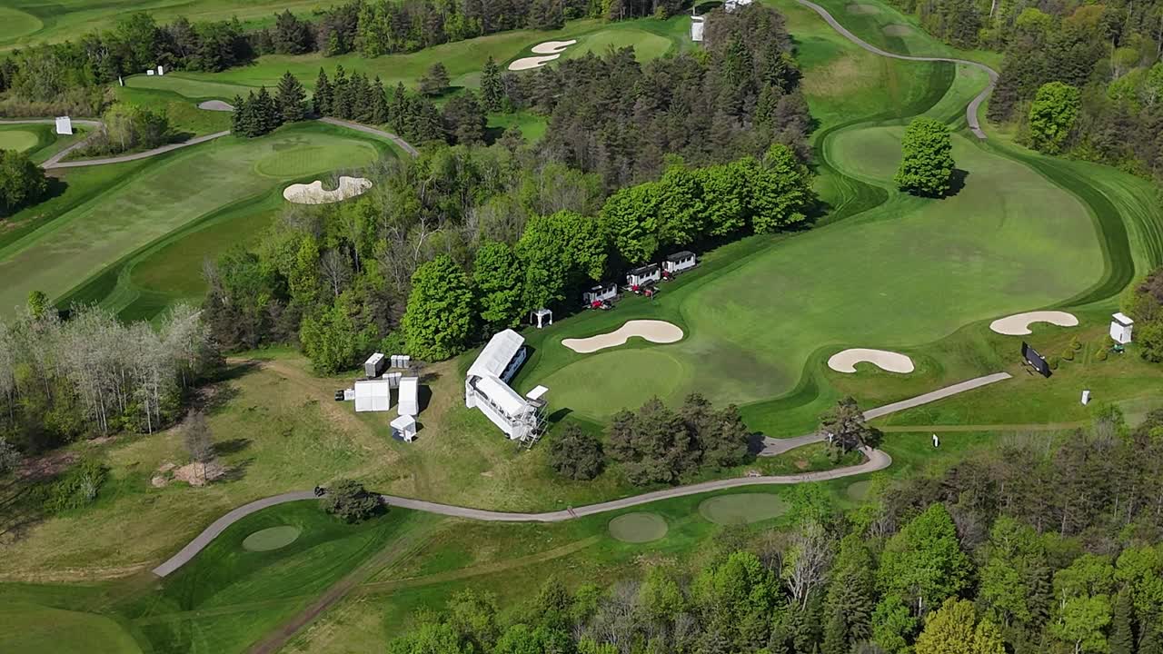 Orbit drone shot of TPC Toronto at Osprey Valley Golf Course during the day in Alton, Caledon, Ontario, Canada