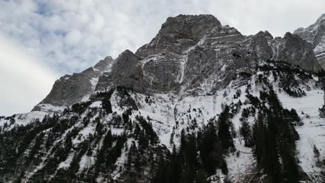 Klöntalersee-Switzerland-Glarus-looking-up-at-peaks-smooth-aerial-with-unique-view